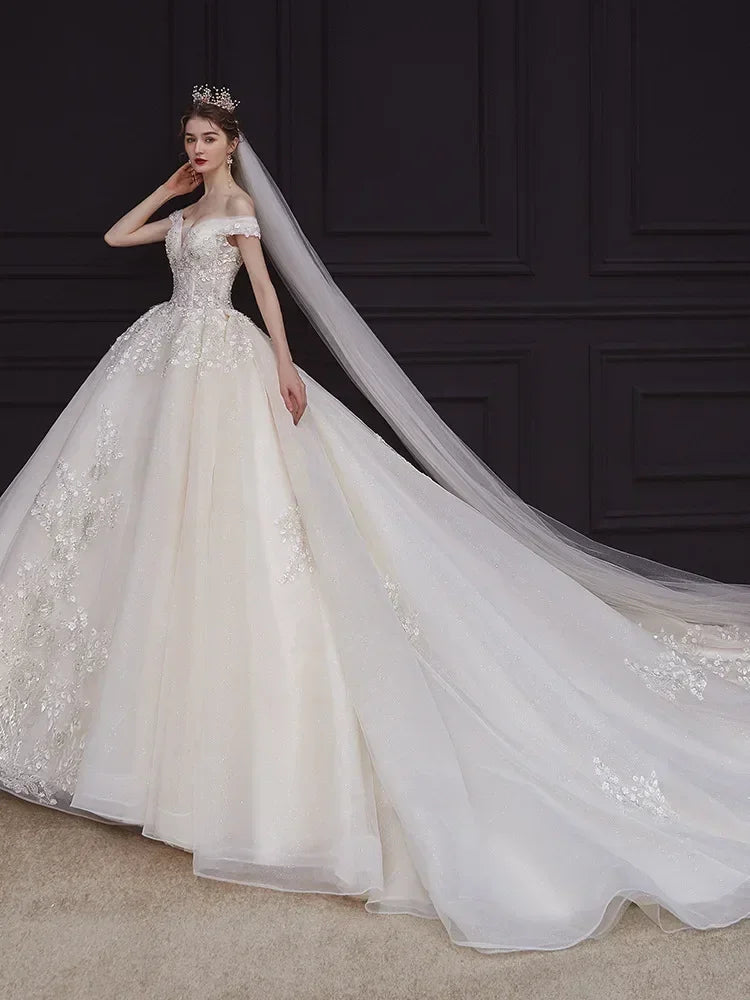 Luxury Off-Shoulder Wedding Dress - Handmade Lace Ball Gown | Femstylo