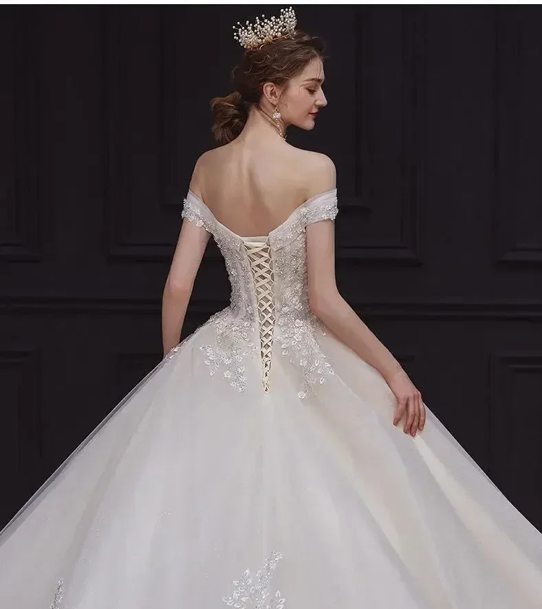 Luxury Off-Shoulder Wedding Dress - Handmade Lace Ball Gown | Femstylo