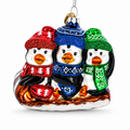Penguin Trio Sledding Glass Christmas Ornament